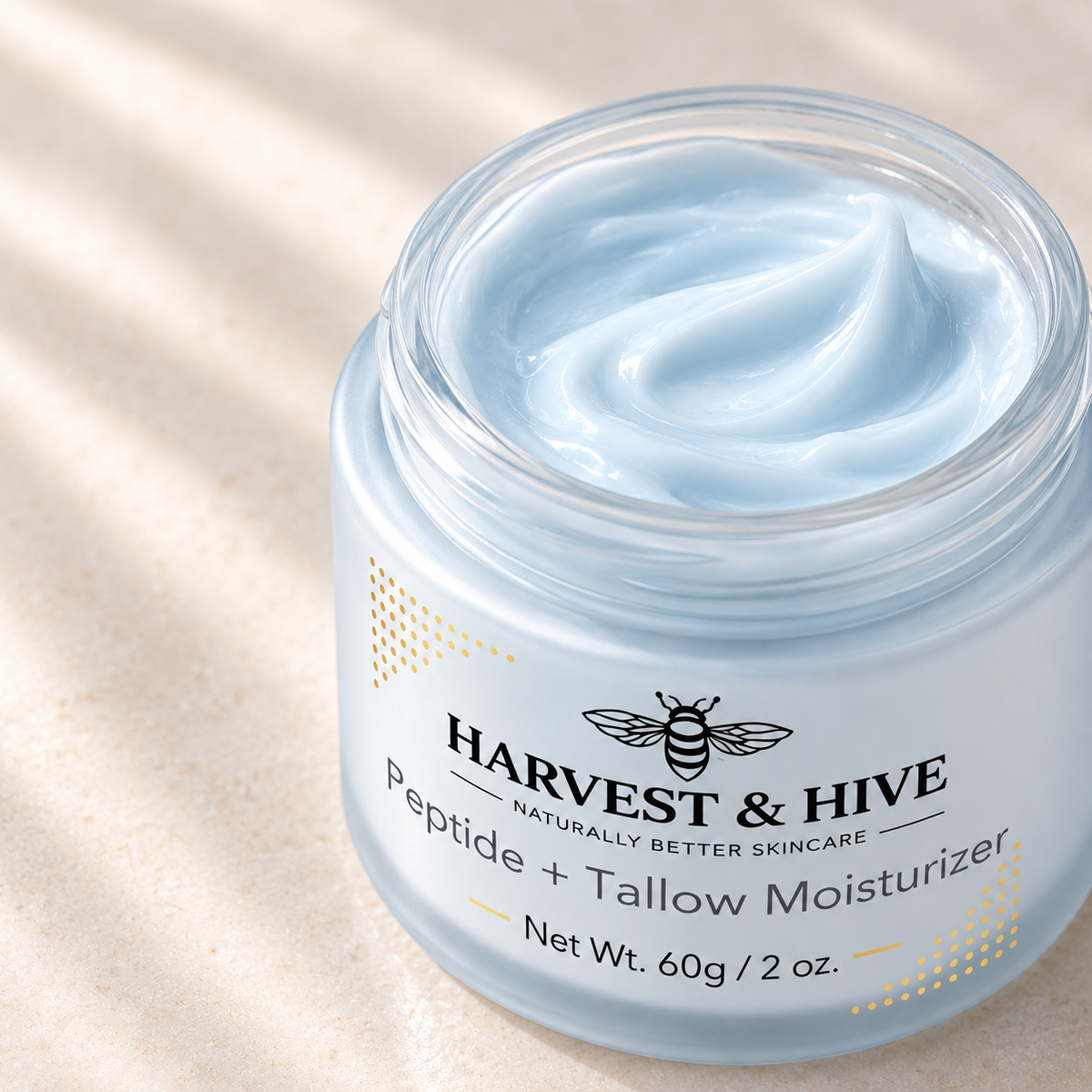 Close-up illustration of the pale blue balm texture in an open Harvest & Hive jar.